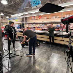 Behind the scenes of a commercial shoot. Crew setting up next shot.